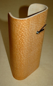 A tall clock formed around a polystyrene mould in a Bagpress